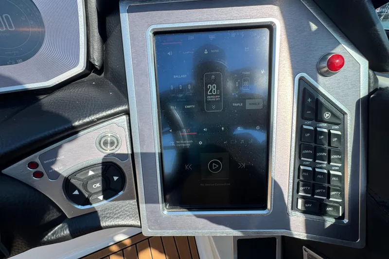 Slide: The Image of 2021 MasterCraft XT22 dashboard with touchscreen controls and navigation buttons. - 17