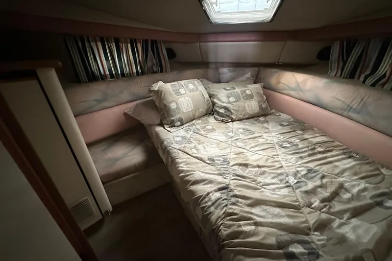 Slide: The Image of 1990 Bayliner 4388 Motoryacht interior with glass doors and covered seating area. - 12