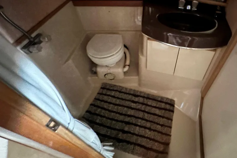 Slide: The Image of Interior of 1990 Bayliner 4388 Motoryacht with seating and helm station. - 13