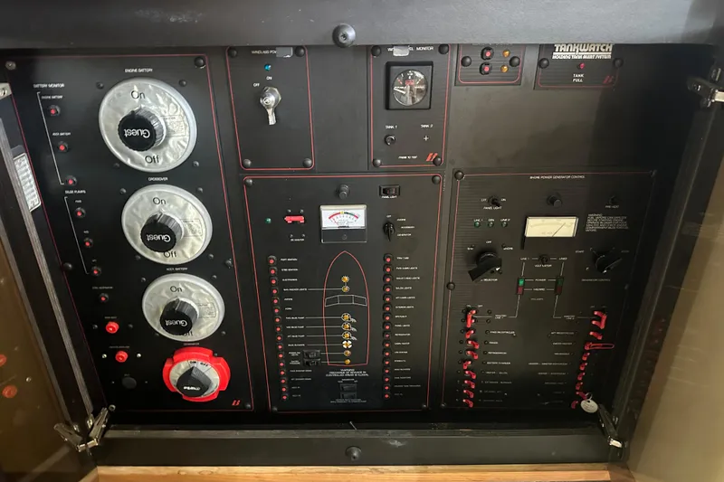 Slide: The Image of Control panel of a 1990 Bayliner 4388 Motoryacht with various switches and gauges. - 16