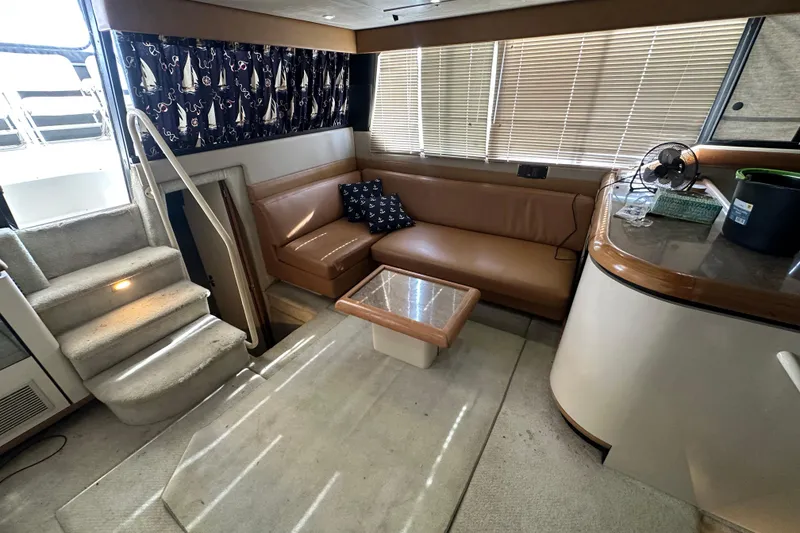 Slide: The Image of 1990 Bayliner 4388 Motoryacht interior with leather seating and nautical decor. - 20