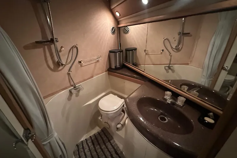 Slide: The Image of Bathroom interior of 1990 Bayliner 4388 Motoryacht with sink, toilet, and shower. - 35