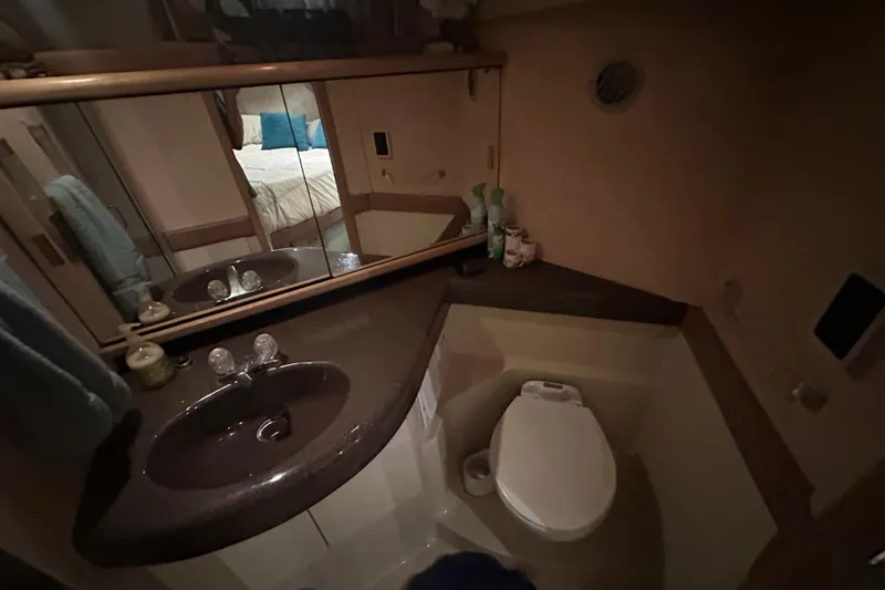 Slide: The Image of Bathroom interior of 1990 Bayliner 4388 Motoryacht with sink and toilet. - 44