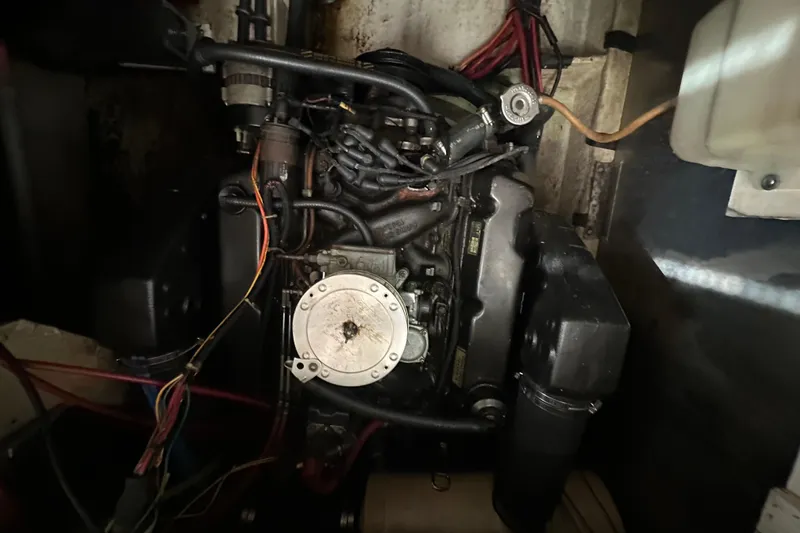 Slide: The Image of Engine compartment of a 1990 Bayliner 4388 Motoryacht with visible wiring and components. - 46