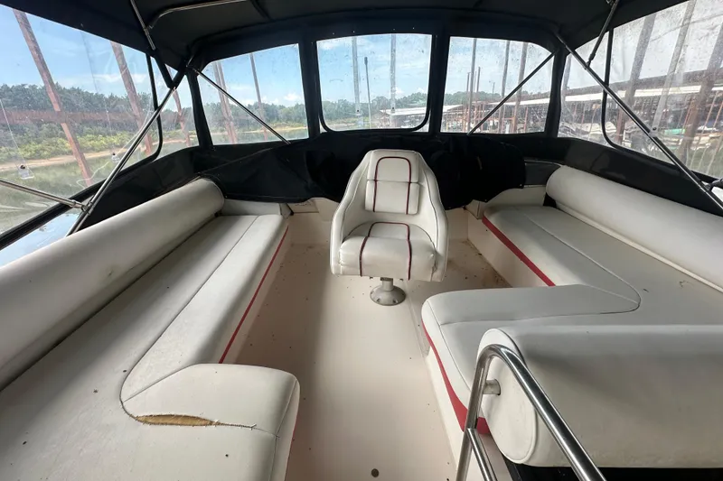 Slide: The Image of 1990 Bayliner 4388 Motoryacht docked, featuring "AQUAHOLIC" name and Sadler, Texas location. - 5