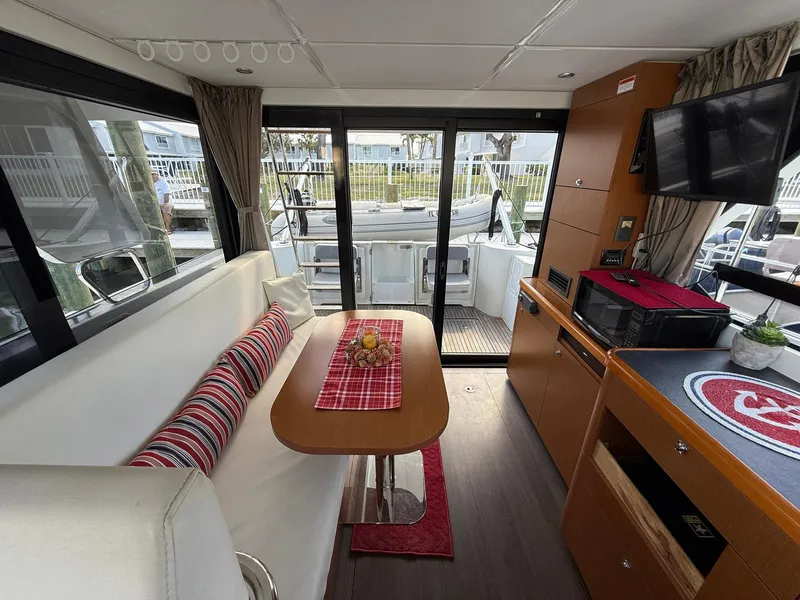 Slide: The Image of 2016 Beneteau Swift Trawler 30, rear deck view with "Seven Grand" nameplate. - 13