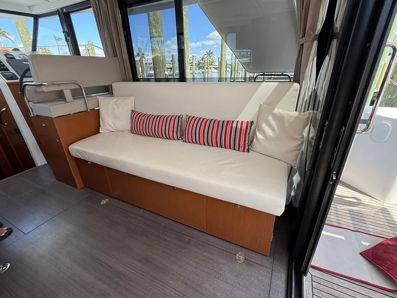 Slide: The Image of Interior of 2016 Beneteau Swift Trawler 30 with cozy seating and modern amenities. - 14
