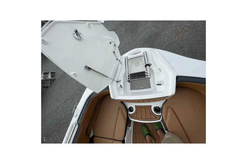 Slide: The Image of 2026 Yamaha Boats 252SD interior with open hatch and seating area. - 11