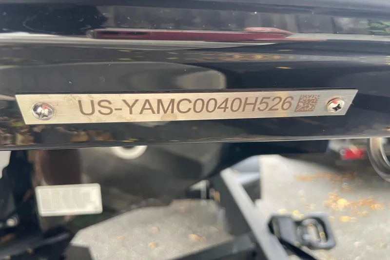 Slide: The Image of 2026 Yamaha Boats 252SD hull identification number plate, US-YAMC0040H526, on black surface. - 20