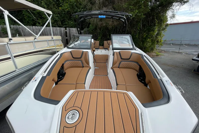 Slide: The Image of 2026 Yamaha Boats 252SD interior with tan seating and sleek design. - 7