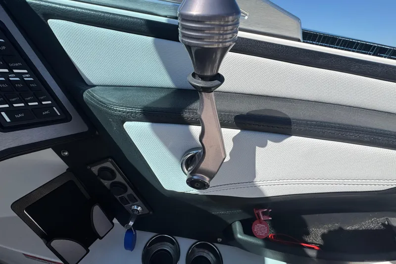 Slide: The Image of Interior of a 2018 MasterCraft XStar boat showing throttle and control panel. - 17
