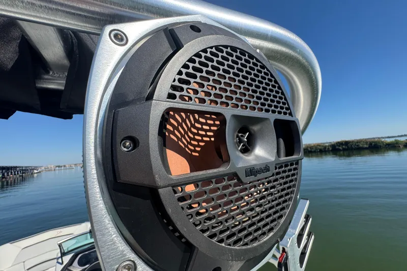 Slide: The Image of Klipsch speaker on 2018 MasterCraft XStar boat, overlooking calm water and clear sky. - 30