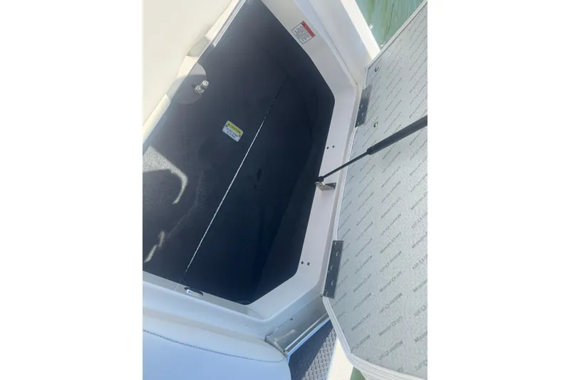 Slide: The Image of Open storage compartment in 2018 MasterCraft XStar boat, showing interior details. - 39