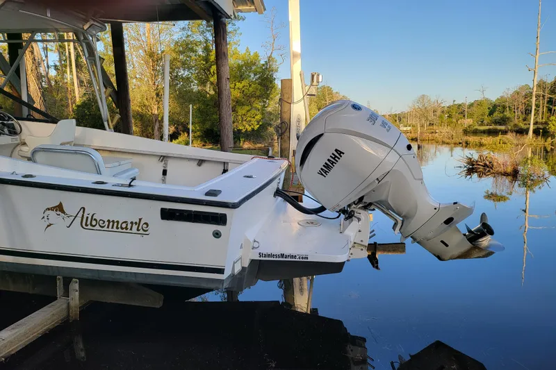 Slide: The Image of 1996 Albemarle 24 Express Cuddy Cabin with Yamaha outboard motor on calm water. - 3