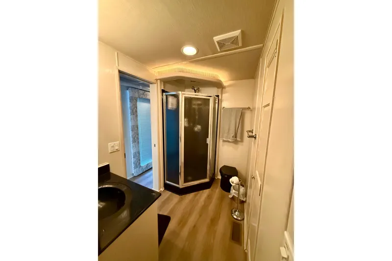 Slide: The Image of Modern houseboat bathroom with shower, sink, and wooden flooring, Fantasy model, 2001. - 14