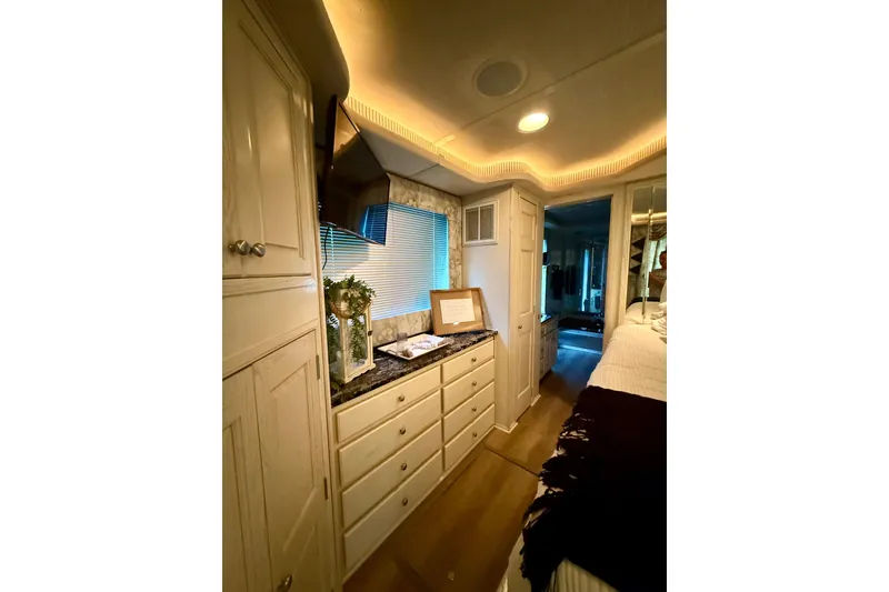 Slide: The Image of Luxurious 2001 Fantasy houseboat interior with elegant cabinetry and ambient lighting. - 19