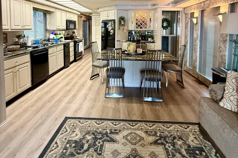 Slide: The Image of Luxurious 2001 Fantasy houseboat interior with modern kitchen and dining area. - 4