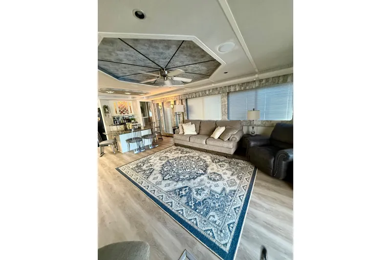 Slide: The Image of Luxurious 2001 Fantasy houseboat interior with elegant decor, plush seating, and patterned rug. - 6