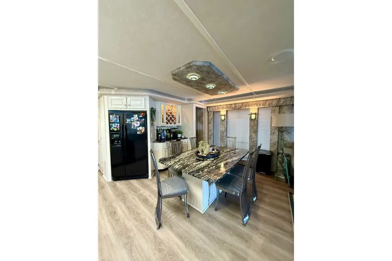 Slide: The Image of Luxurious 2001 Fantasy houseboat interior with modern kitchen and elegant dining area. - 7