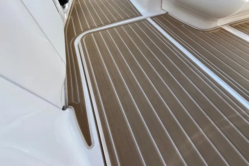 Slide: The Image of Teak-style deck flooring on 2002 Sea Ray 300 Sundancer boat. - 8