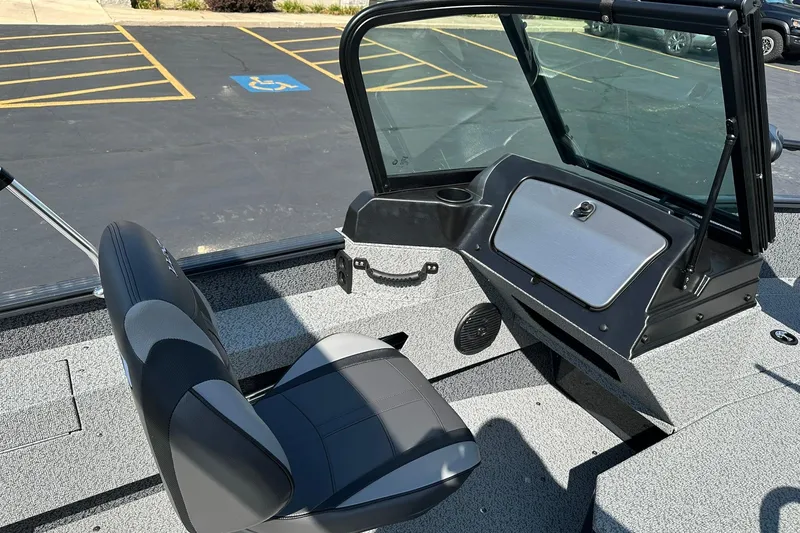 Slide: The Image of 2026 Lund 1775 Adventure Sport boat interior with storage compartments and seating. - 17