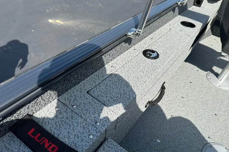 Slide: The Image of Control panel of 2026 Lund 1775 Adventure Sport boat with audio system and power outlets. - 19