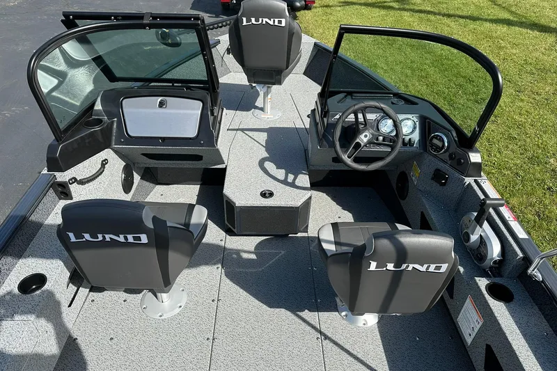 Slide: The Image of 2026 Lund 1775 Adventure Sport boat on trailer outside dealership. - 2