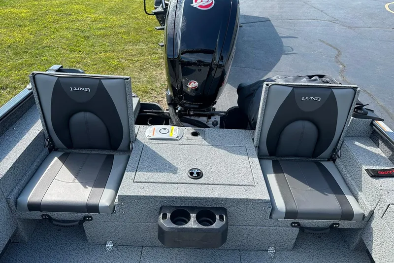 Slide: The Image of 2026 Lund 1775 Adventure Sport boat interior with steering wheel and seating. - 7