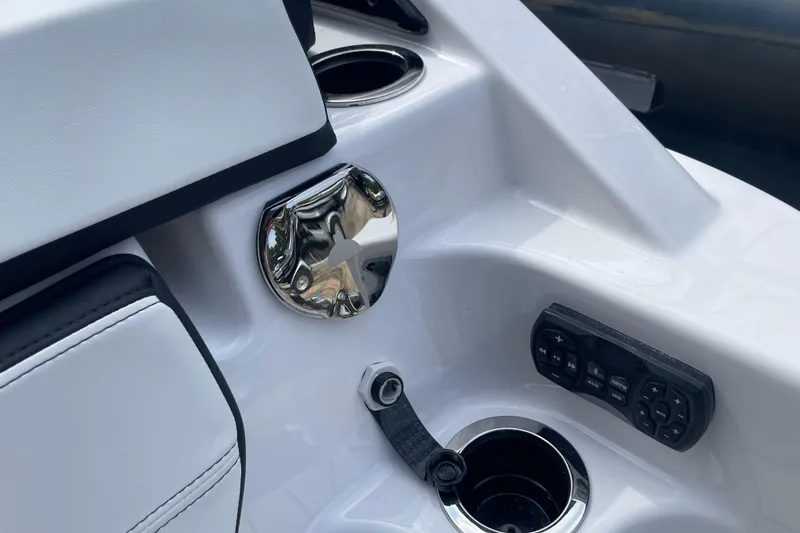 Slide: The Image of 2026 Yamaha Boats 252SD interior detail with control panel and cup holder. - 12