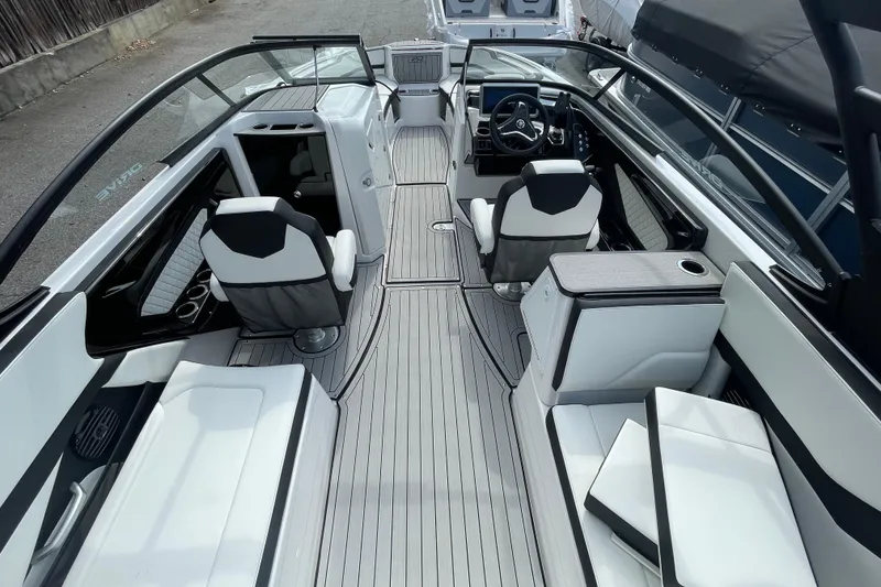 Slide: The Image of 2026 Yamaha Boats 252SD interior with sleek seating and modern dashboard design. - 13