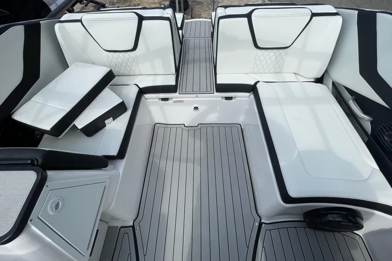 Slide: The Image of 2026 Yamaha Boats 252SD interior with sleek white seating and modern design. - 14