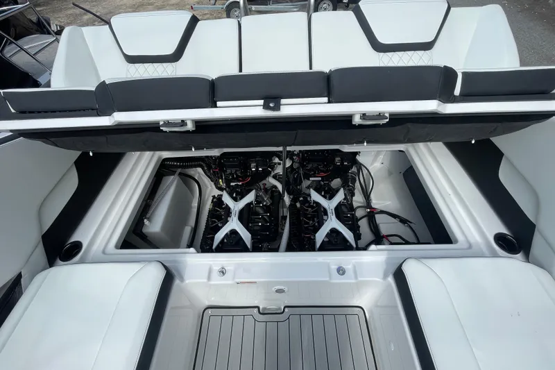 Slide: The Image of 2026 Yamaha Boats 252SD engine compartment with dual engines and sleek interior design. - 17