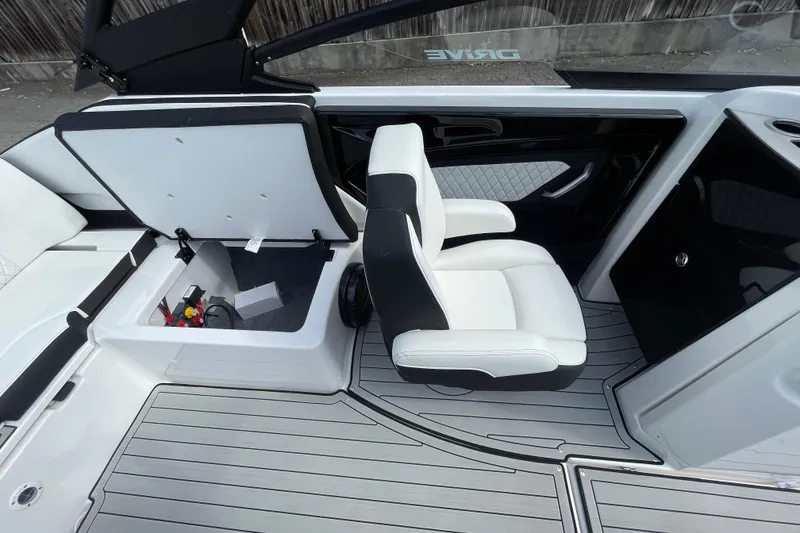 Slide: The Image of 2026 Yamaha Boats 252SD interior with open storage compartment and sleek seating design. - 18