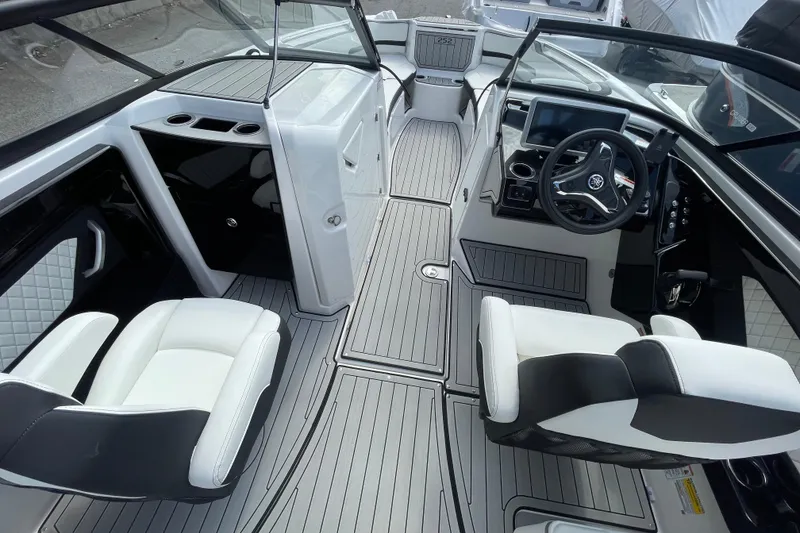 Slide: The Image of 2026 Yamaha Boats 252SD interior with sleek design, modern dashboard, and comfortable seating. - 19