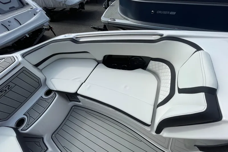 Slide: The Image of 2026 Yamaha Boats 252SD interior with white cushioned seating and sleek design. - 21