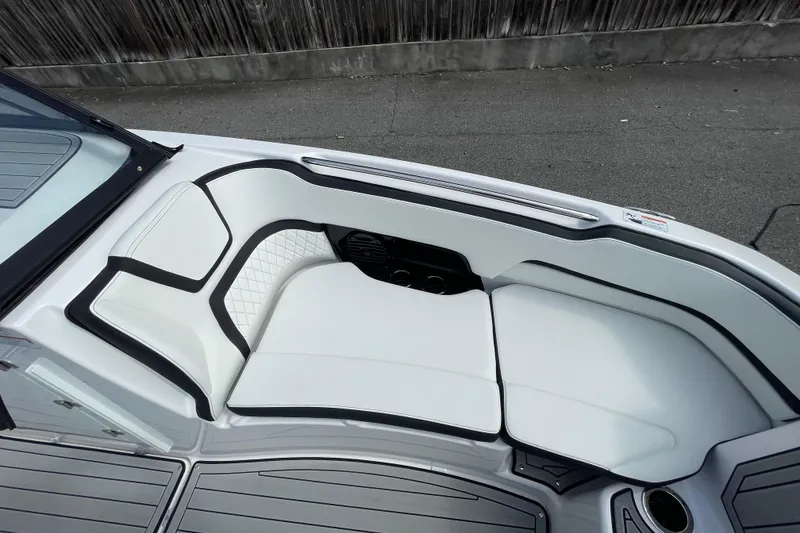 Slide: The Image of Luxurious seating on 2026 Yamaha Boats 252SD, featuring sleek white upholstery and modern design. - 22