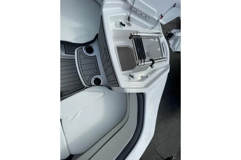 Slide: The Image of 2026 Yamaha Boats 252SD interior with seating and cup holders. - 23