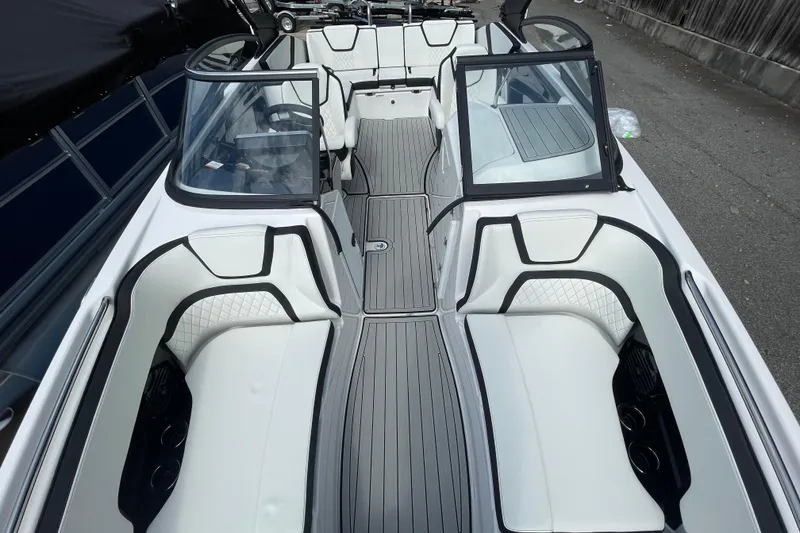 Slide: The Image of 2026 Yamaha Boats 252SD interior with sleek white seating and modern design. - 24