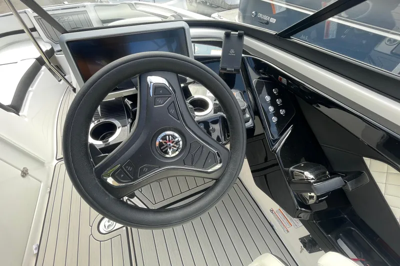 Slide: The Image of 2026 Yamaha Boats 252SD steering wheel and dashboard, featuring modern controls and sleek design. - 8