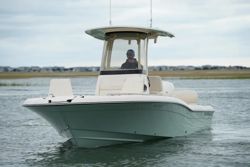 Slide: The Image of 2025 Grady-White 251 Coastal Explorer boat cruising on calm waters. - 13