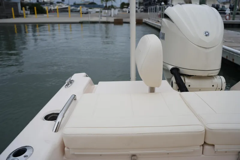 Slide: The Image of 2025 Grady-White 251 Coastal Explorer boat with cushioned seating and Yamaha outboard motor. - 21