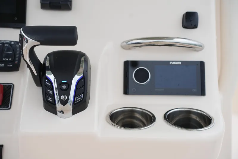 Slide: The Image of Control panel of 2025 Grady-White 251 Coastal Explorer with throttle and Fusion stereo. - 28