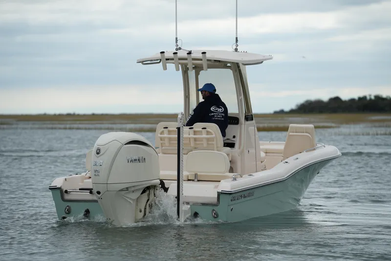 Slide: The Image of 2025 Grady-White 251 Coastal Explorer boat on water, featuring Yamaha engine. - 3