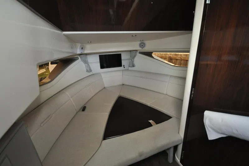 Slide: The Image of Interior of 2020 Sea Ray Sundancer 320, featuring a cozy seating area and modern design. - 12