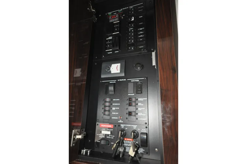 Slide: The Image of Electrical control panel of 2020 Sea Ray Sundancer 320 boat, featuring switches and gauges. - 14