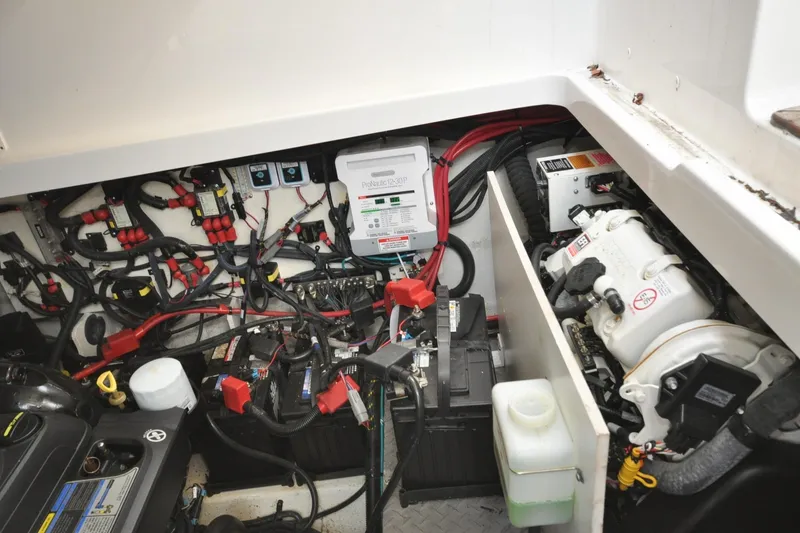 Slide: The Image of Engine compartment of 2020 Sea Ray Sundancer 320, showcasing wiring and components. - 17