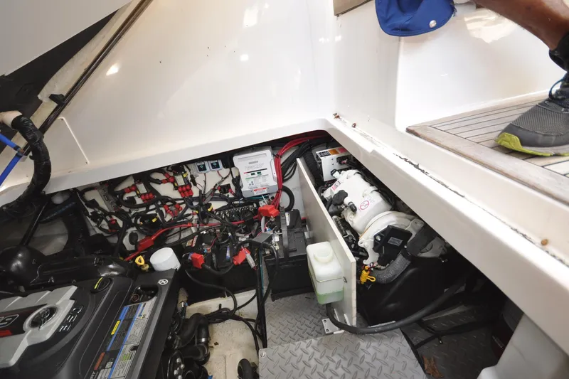 Slide: The Image of Engine compartment of 2020 Sea Ray Sundancer 320, showcasing wiring and mechanical components. - 19