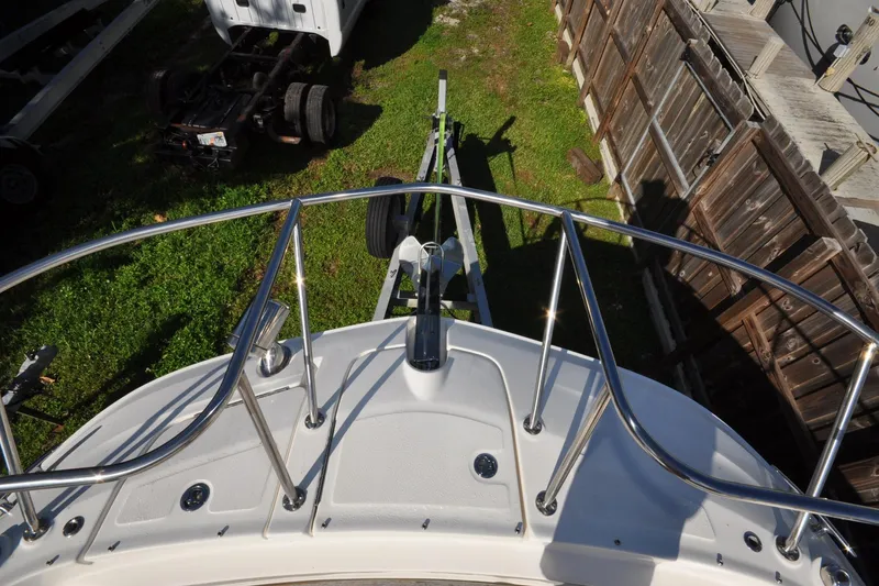 Slide: The Image of 2020 Sea Ray Sundancer 320 bow view with railing and trailer. - 6