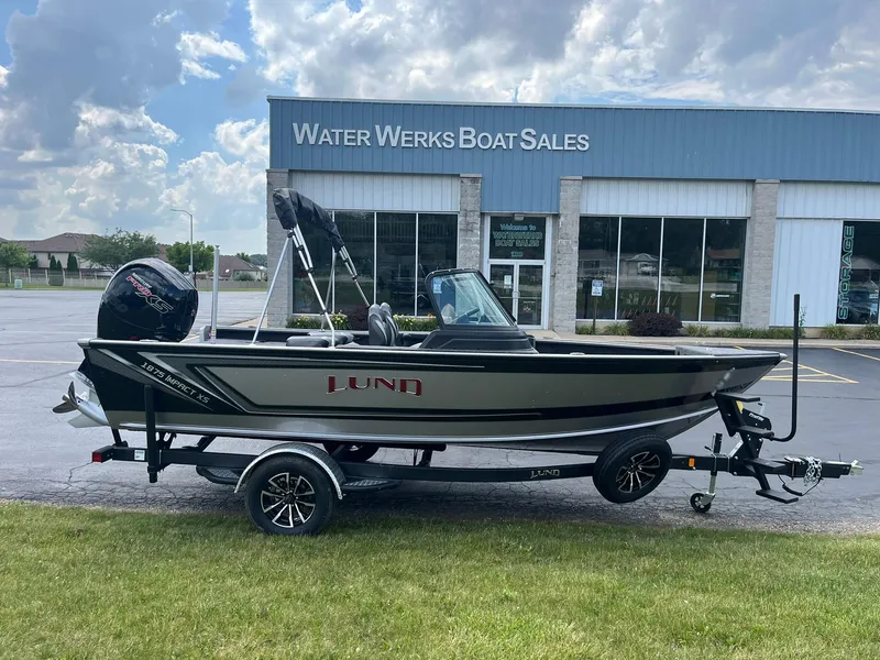 The Image of 2026 Lund 1875 Impact XS Sport boat on trailer at Water Werks Boat Sales. - 0
