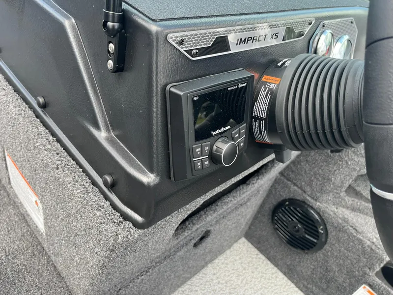 Slide: The Image of 2026 Lund 1875 Impact XS Sport dashboard with audio controls and ventilation system. - 22